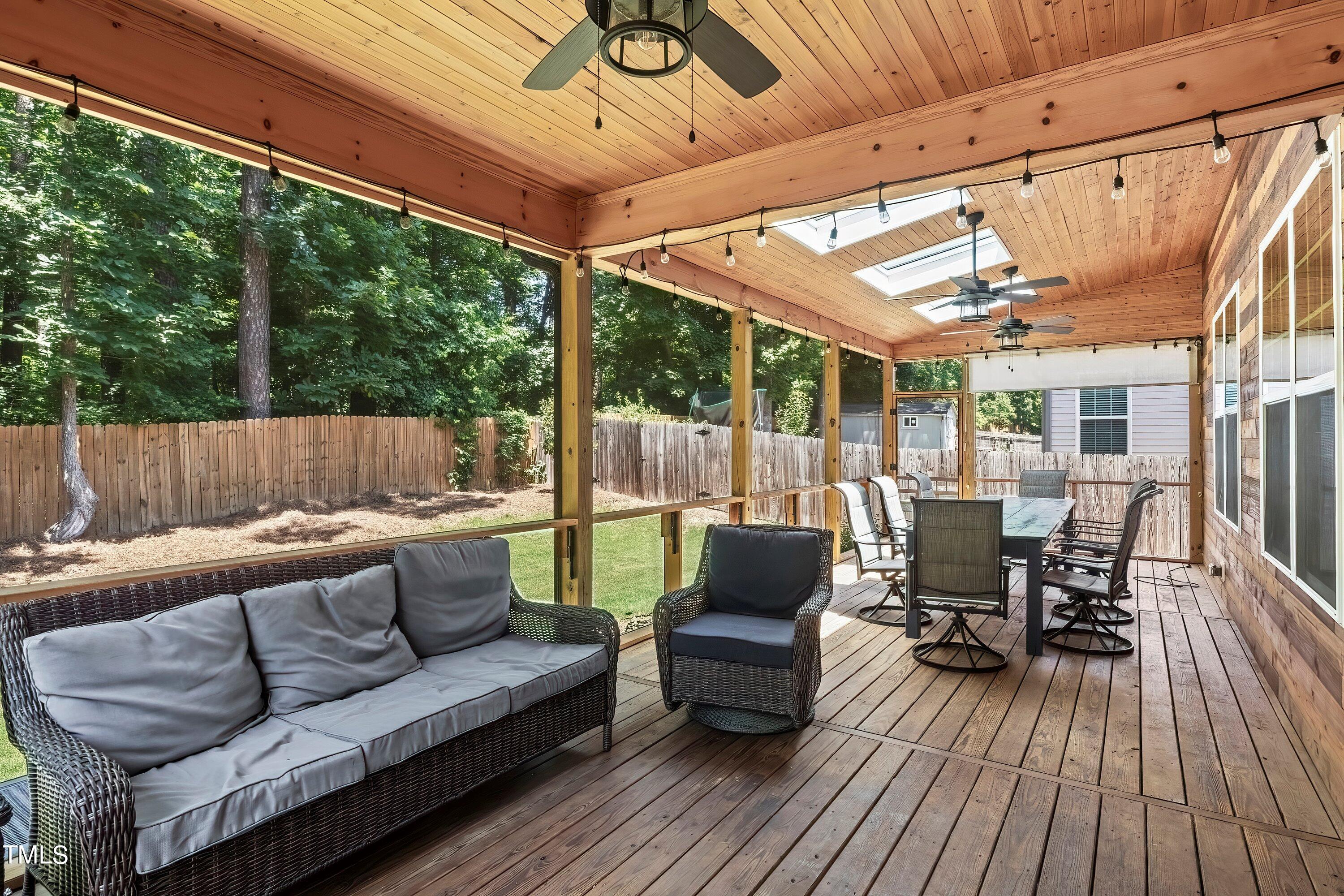 7406 Randshire Way Raleigh, NC 27616 - Photo 32 of 38 a outdoor living space with furniture and wooden floor