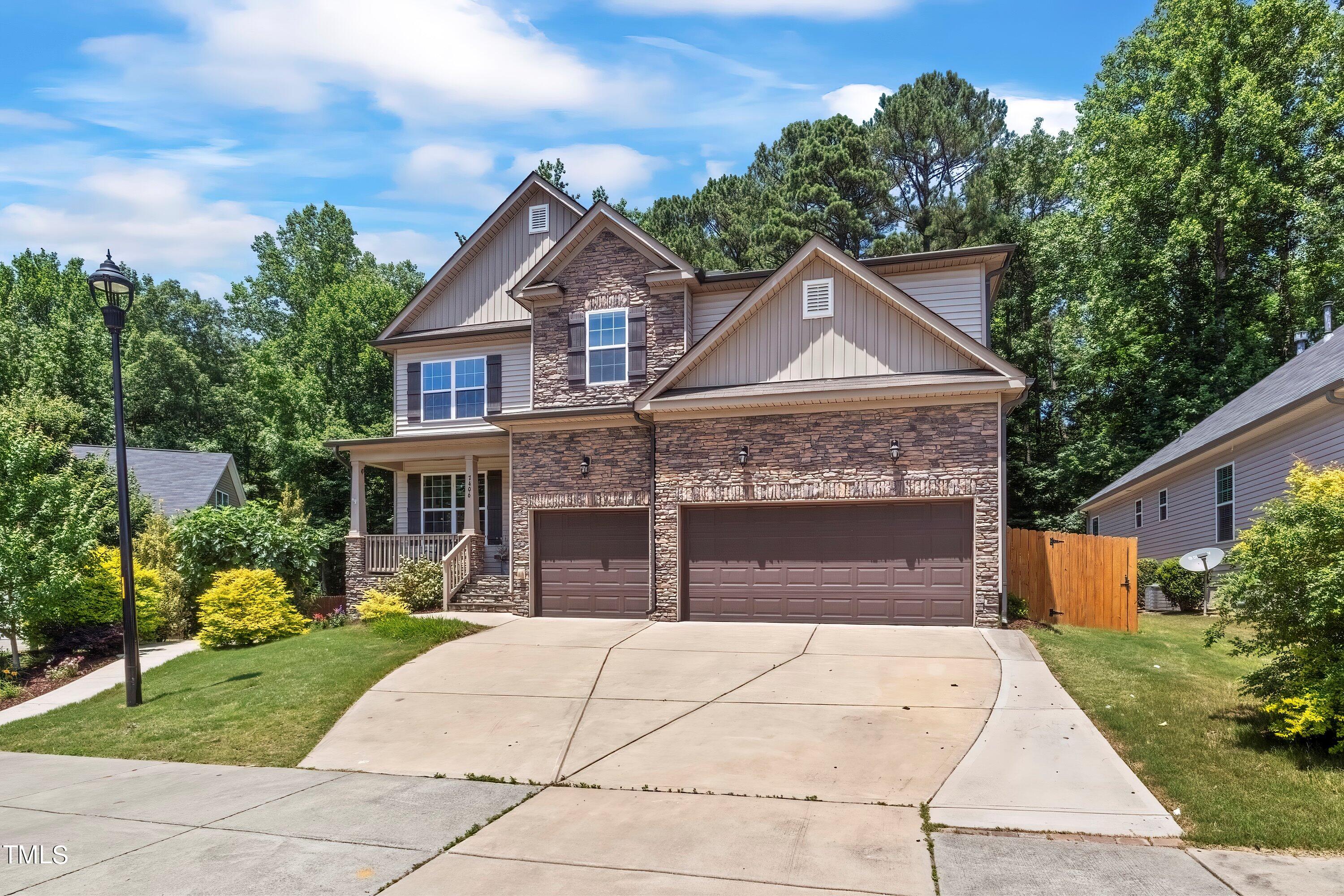 7406 Randshire Way Raleigh, NC 27616 - Photo 38 of 38 a front view of a house with a garden and plants