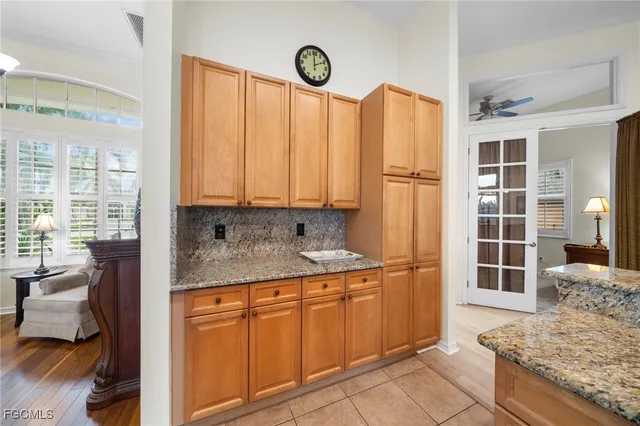 a kitchen with stainless steel appliances granite countertop a refrigerator sink and cabinets