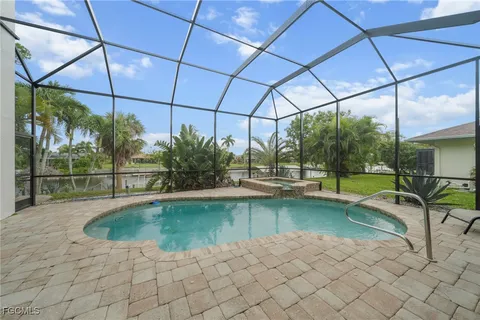 a view of a swimming pool with a patio