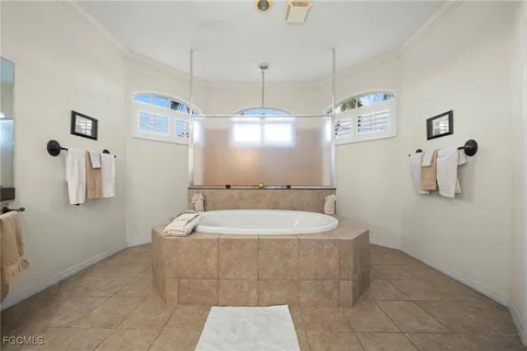 a bath room with a bath tub and a sink