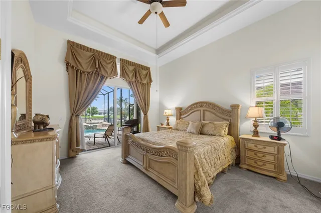 a bedroom with a bed next to a large window with the outer view