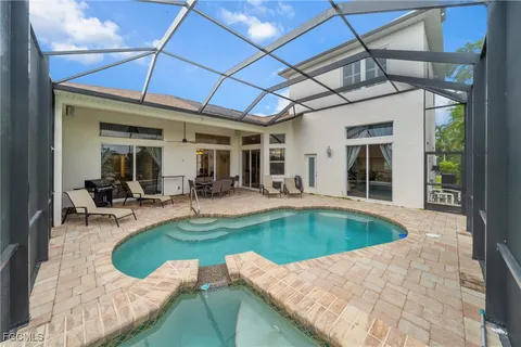 a view of a patio with couches chairs and potted plants