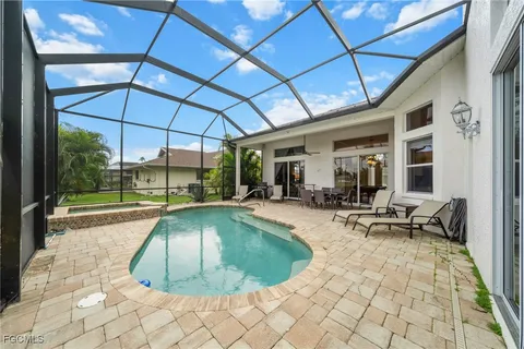 a view of a swimming pool with a patio