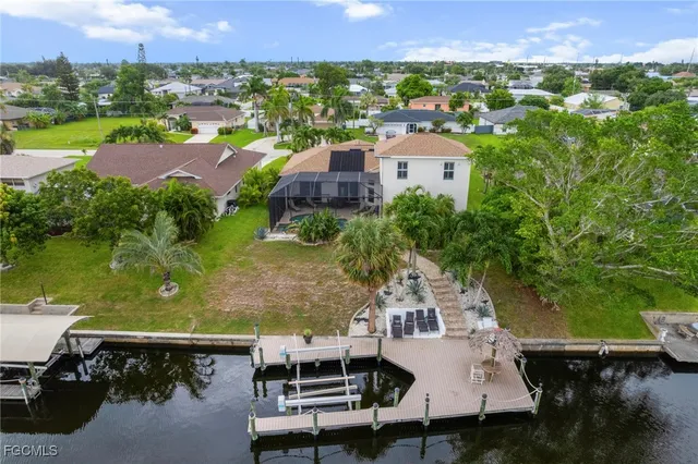 an aerial view of a house with a lake view