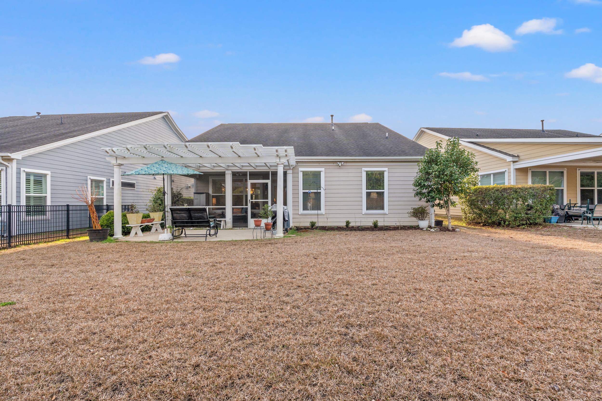 1979 Suncrest Drive Myrtle Beach, SC 29577 - Photo 14 of 28 Rear view of property with a patio, a pergola, and a shingled roof