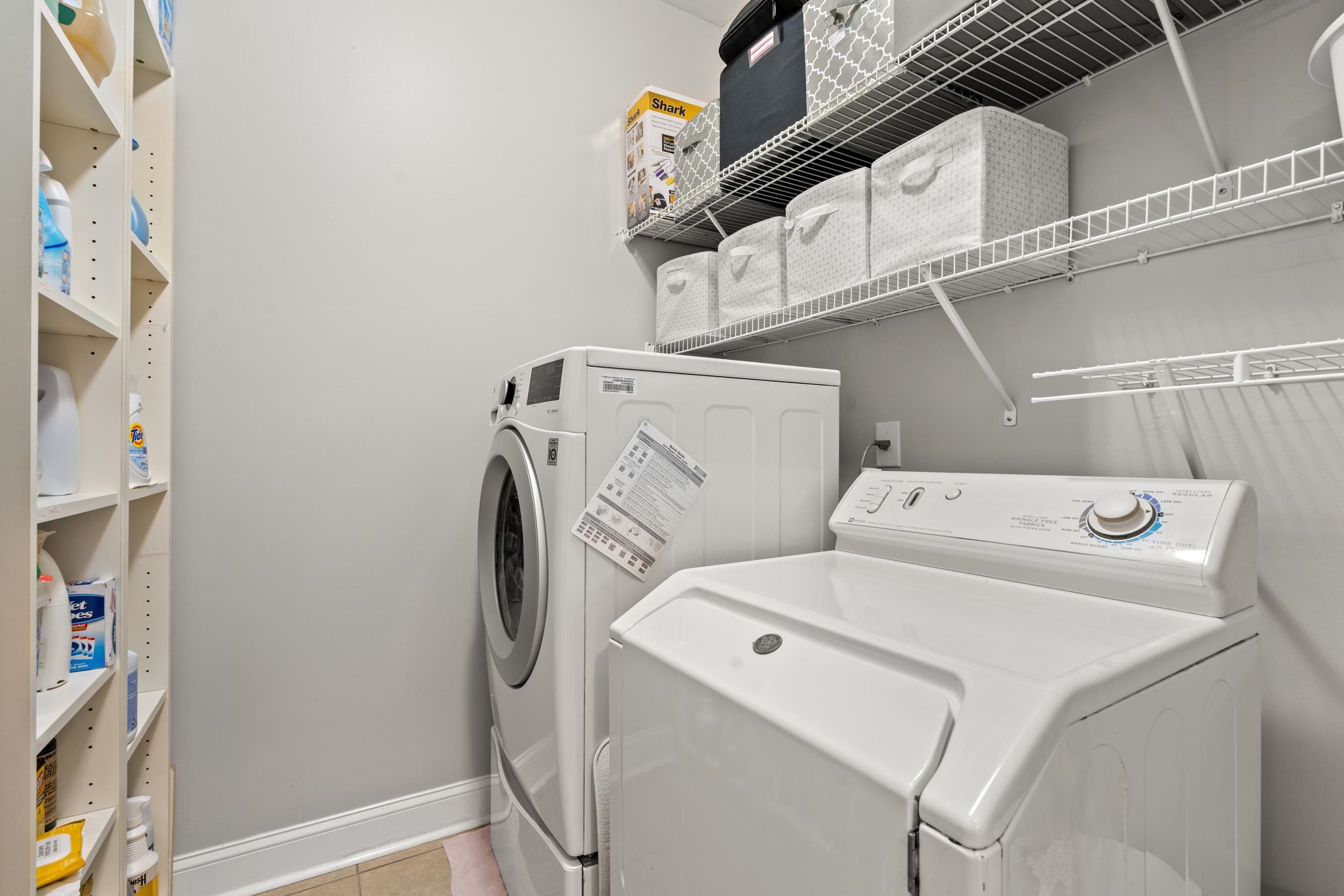 1979 Suncrest Drive Myrtle Beach, SC 29577 - Photo 15 of 28 Laundry room with washing machine and dryer and light tile patterned floors