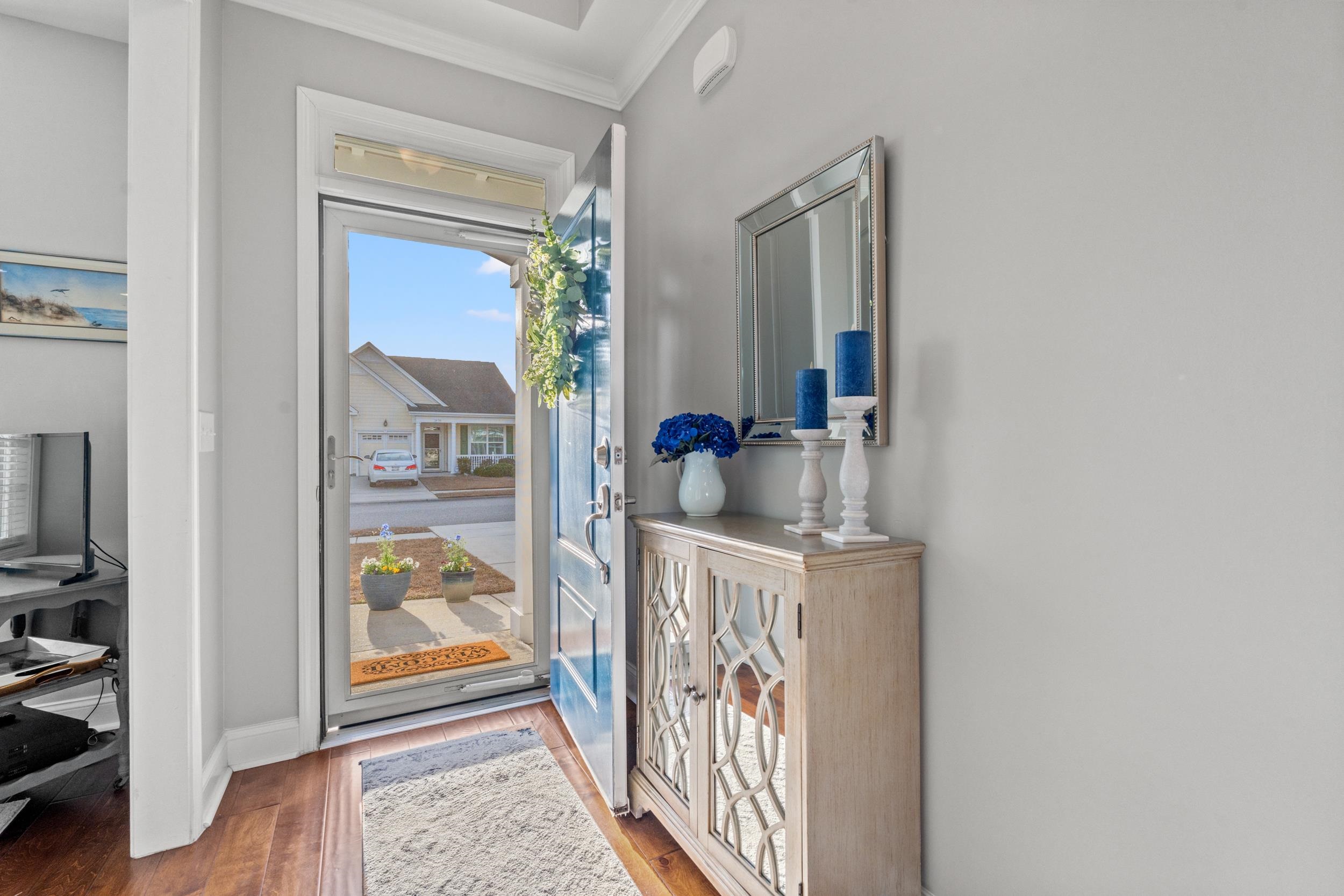 1979 Suncrest Drive Myrtle Beach, SC 29577 - Photo 2 of 28 Doorway to outside with wood finished floors and ornamental molding