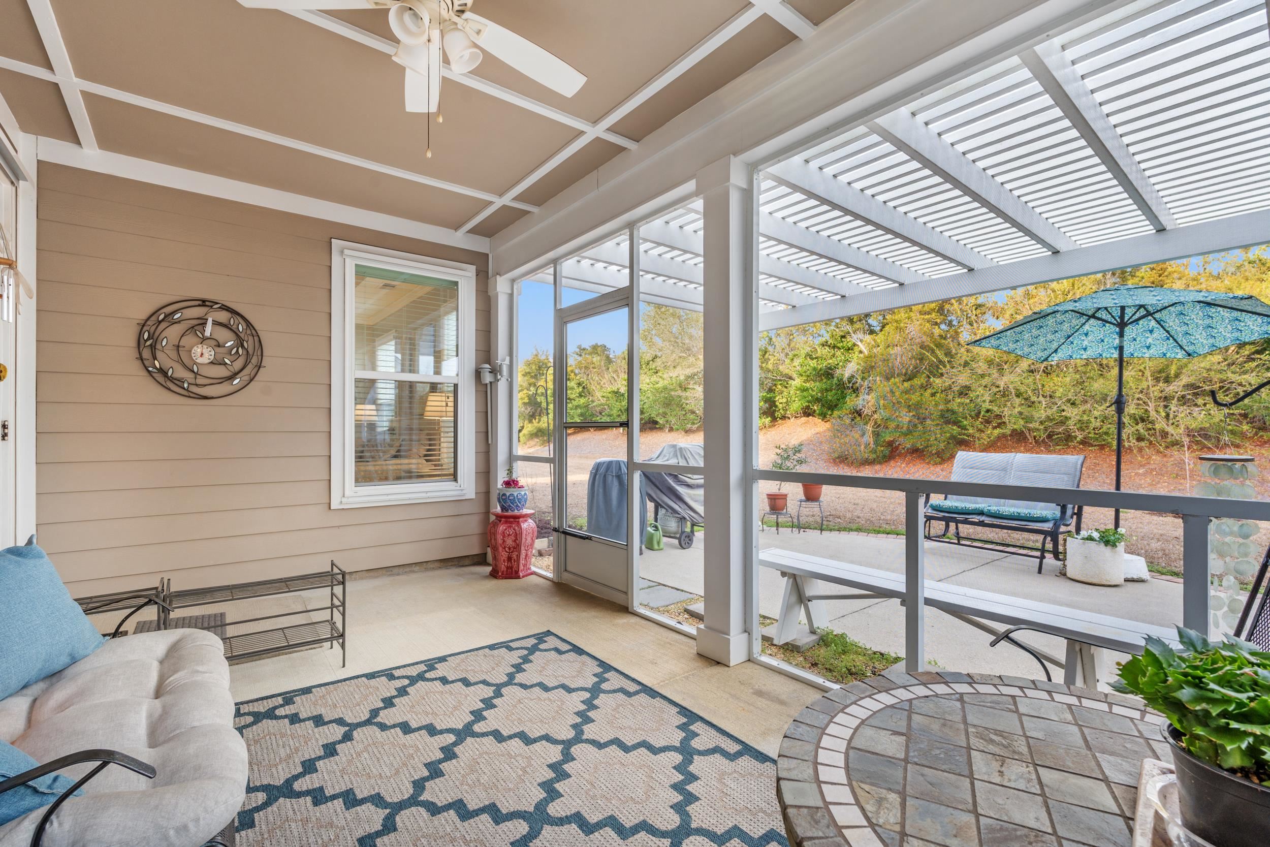 1979 Suncrest Drive Myrtle Beach, SC 29577 - Photo 6 of 28 Sunroom with a patio and a ceiling fan