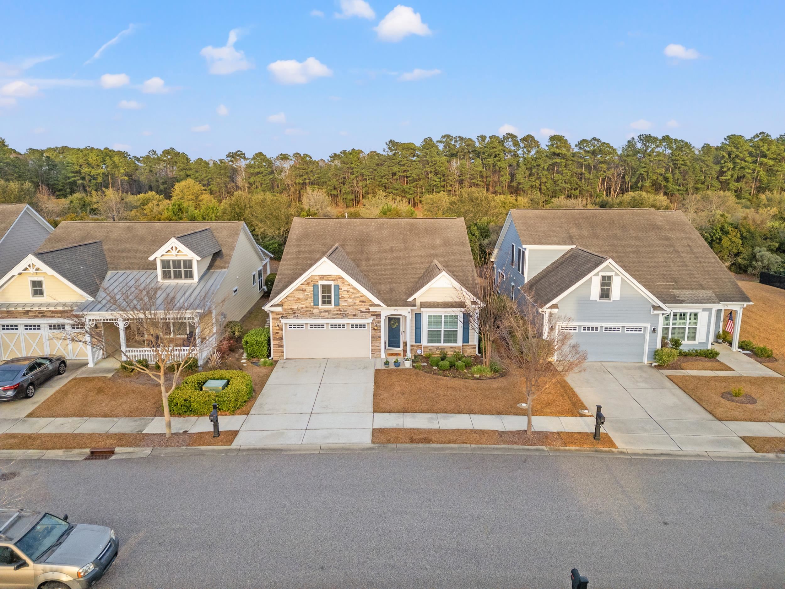 1979 Suncrest Drive Myrtle Beach, SC 29577 - Photo 10 of 28 View of front of home with driveway, stone siding, and an attached garage
