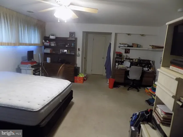 a bed room with a bed and furniture