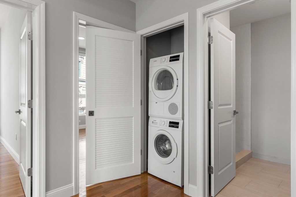 10 Taber Street, Unit 501 Boston, MA 02119 - Photo 14 of 35 a utility room with dryer and washer