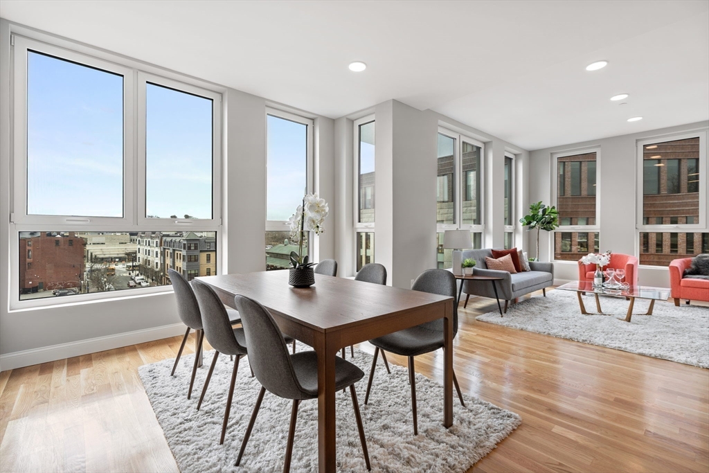 10 Taber Street, Unit 501 Boston, MA 02119 - Photo 22 of 35 a view of a dining room with furniture window and wooden floor