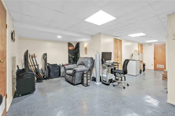 a living room with furniture a dining table and chairs