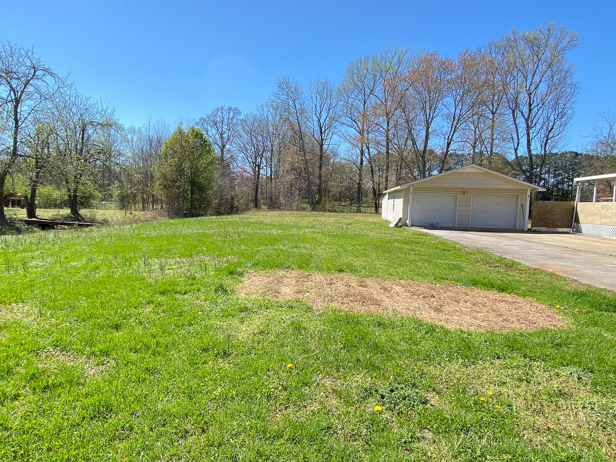 72 Pratt Road Manchester, TN 37355 - Photo 22 of 24 a backyard of a house with trees and outdoor space