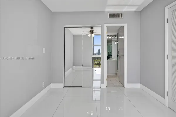 a bathroom with a sink a mirror and a shower