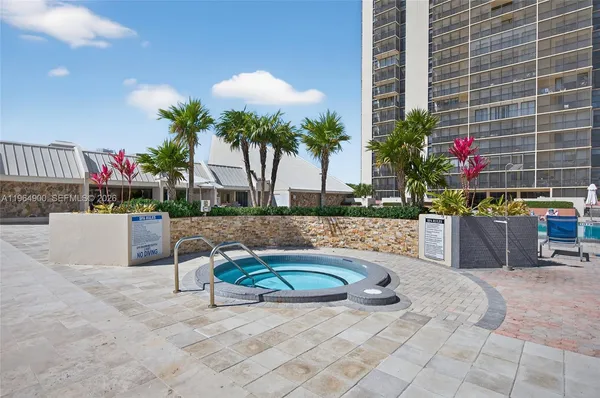 a view of a swimming pool with chairs
