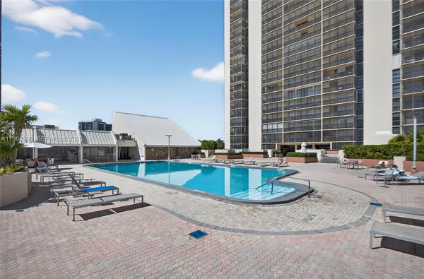 a kitchen with a sink and a stove top oven