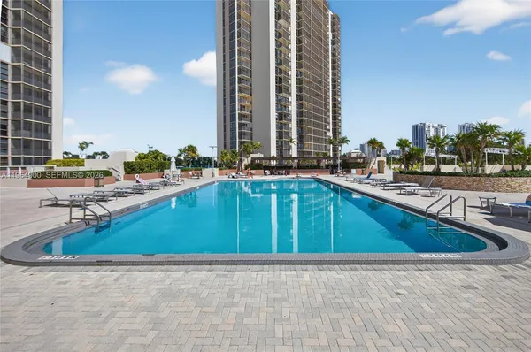 a view of roof deck with a barbeque and wooden stairs