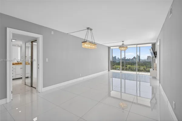 a view of an empty room with glass door