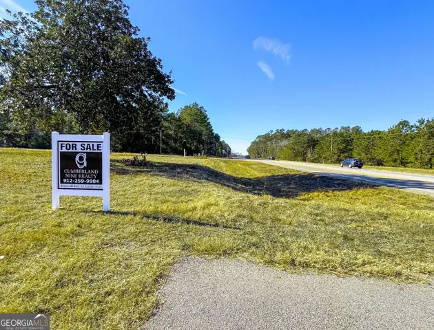 a view of a swimming pool with a yard