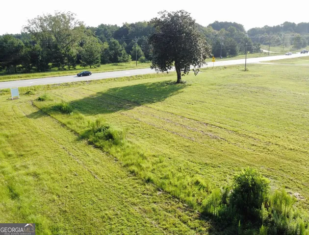 a view of a swimming pool with a yard