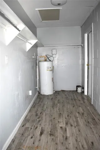 a view of a storage & utility room with a sink
