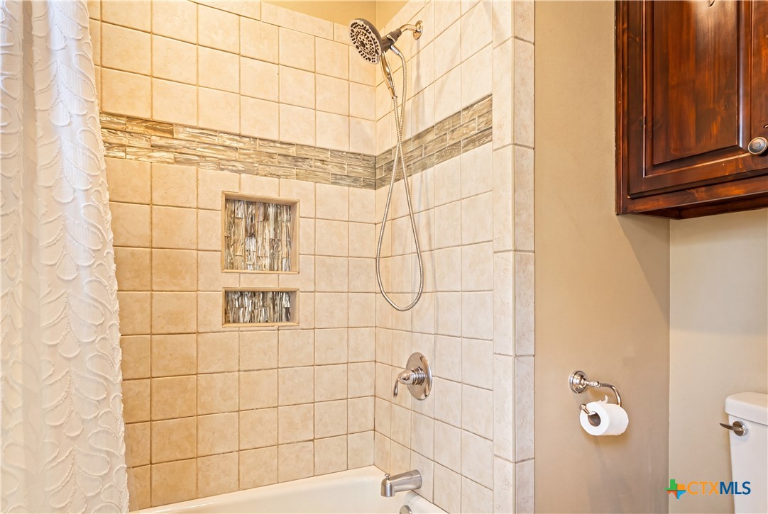 790 Spanish Grant Road Goliad, TX 77963 - Photo 27 of 41 a bathroom with a shower