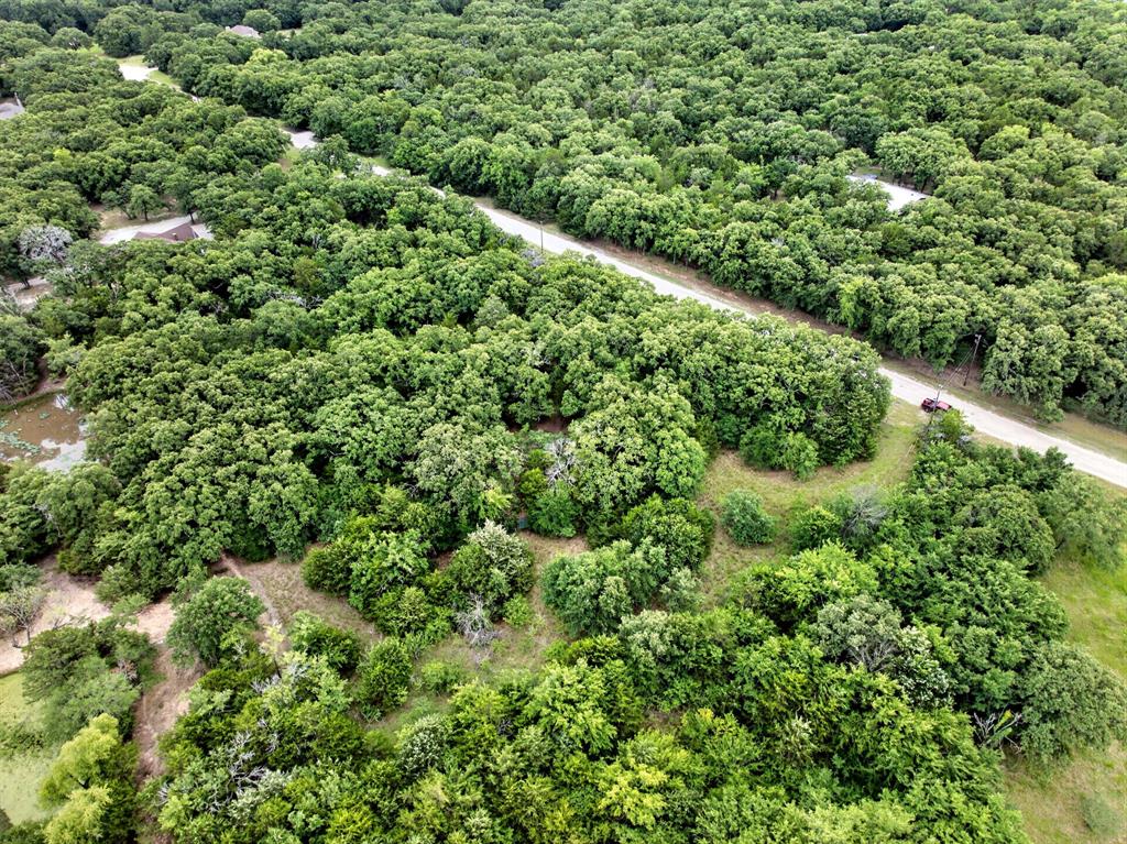 Tbd Woodland Estates Road Terrell, TX 75160 - Photo 4 of 22 an aerial view of residential house with outdoor space and trees all around