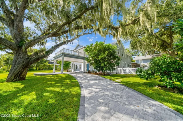 a view of a livingroom with furniture wooden floor and a window