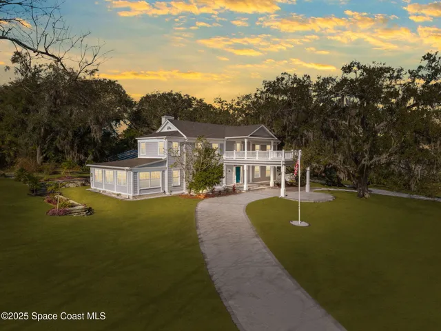 a view of house with garden space and swimming pool