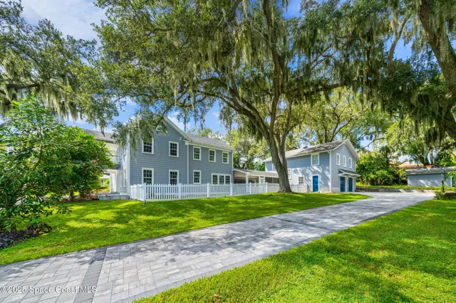 a spacious bedroom with a bed and a fireplace
