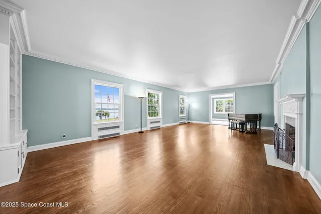 a bedroom with furniture and a chandelier
