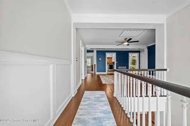 a view of a hall with wooden floor