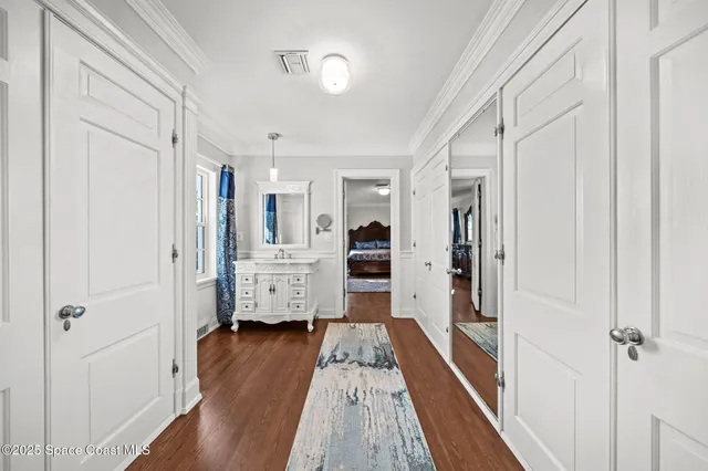 an aerial view of a house with a yard and swimming pool
