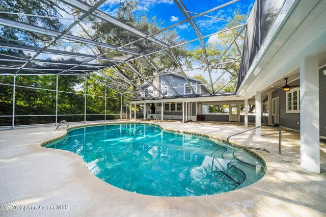 a bedroom with bed and wooden floor
