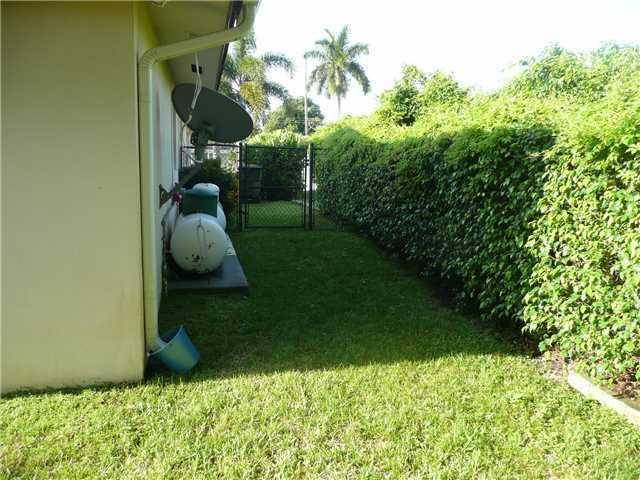777 Southwest 7th Street Boca Raton, FL 33486 - Photo 8 of 26 Side yard propane tank