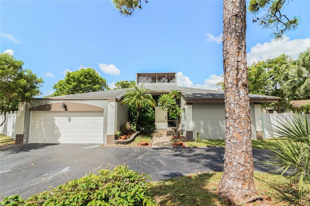 8067 Buttonwood Circle Tamarac, FL 33321 - Photo 1 of 33 a view of outdoor space and yard