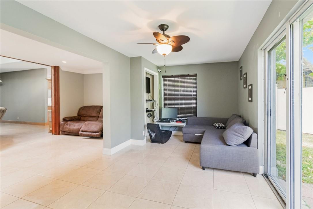 8067 Buttonwood Circle Tamarac, FL 33321 - Photo 18 of 33 a bedroom with furniture and a large mirror