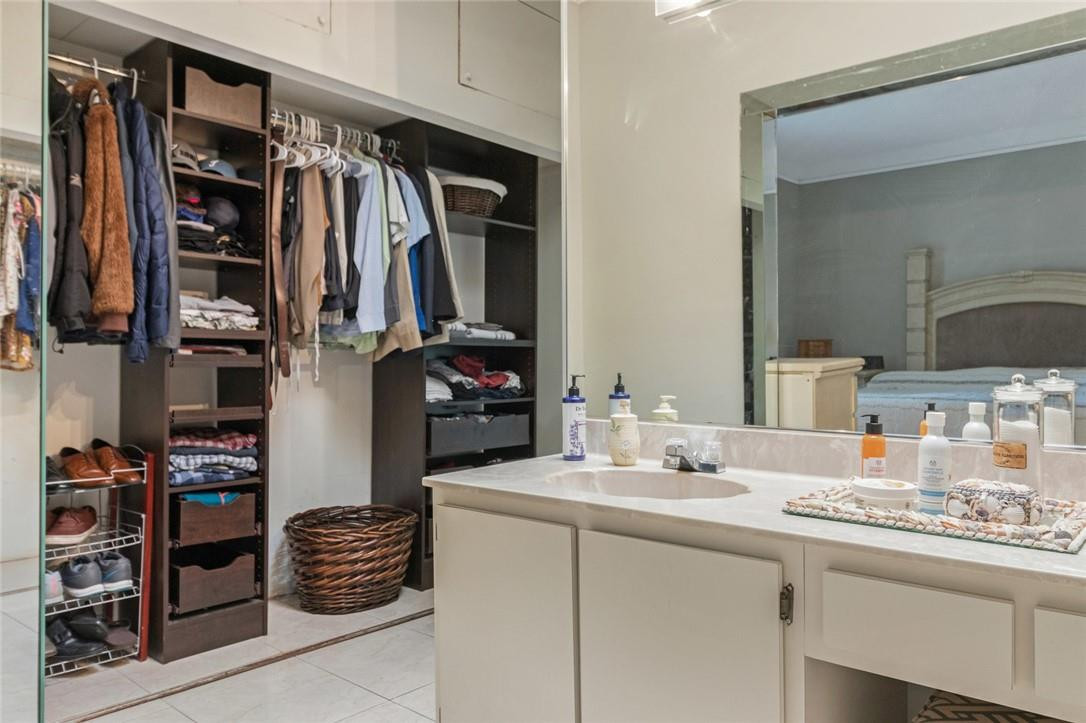 8067 Buttonwood Circle Tamarac, FL 33321 - Photo 19 of 33 a kitchen with a sink and cabinets