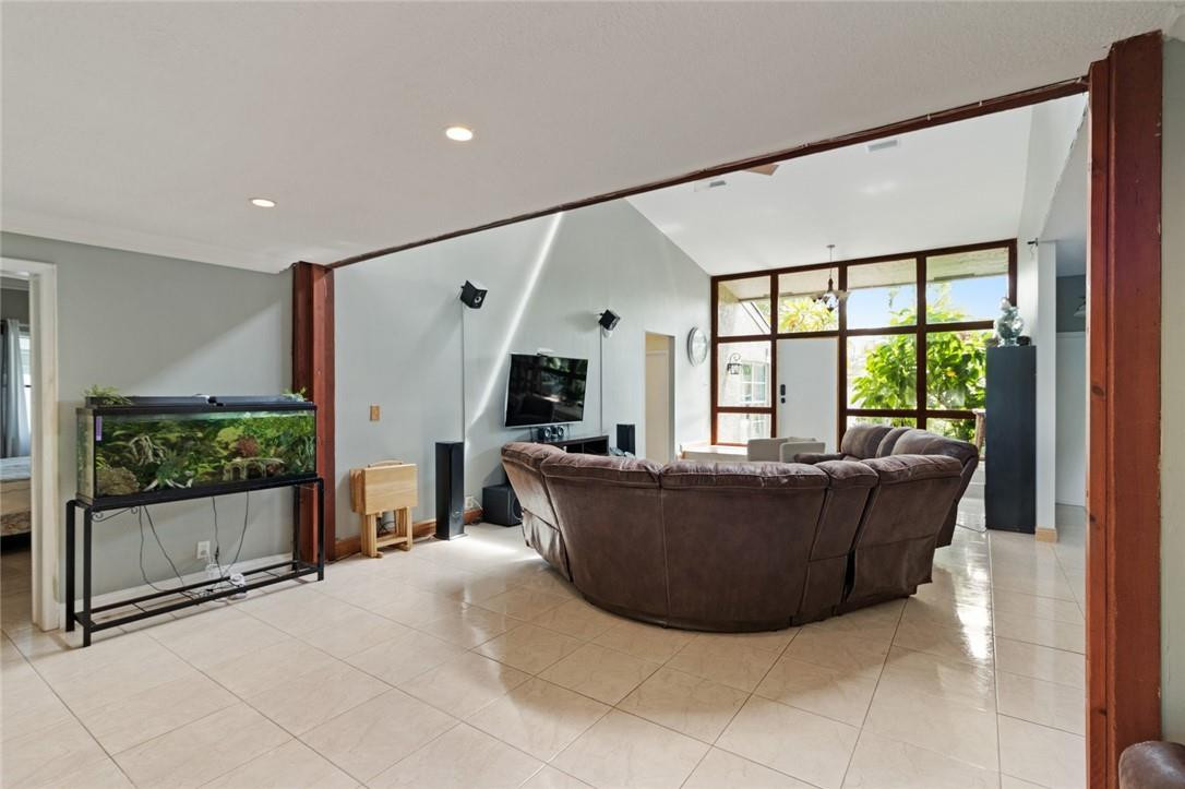 8067 Buttonwood Circle Tamarac, FL 33321 - Photo 21 of 33 a living room with furniture and large windows