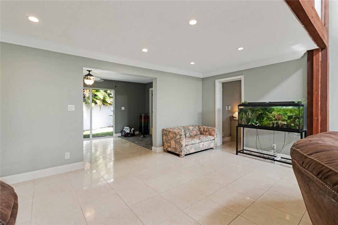 8067 Buttonwood Circle Tamarac, FL 33321 - Photo 22 of 33 a living room with furniture and a flat screen tv