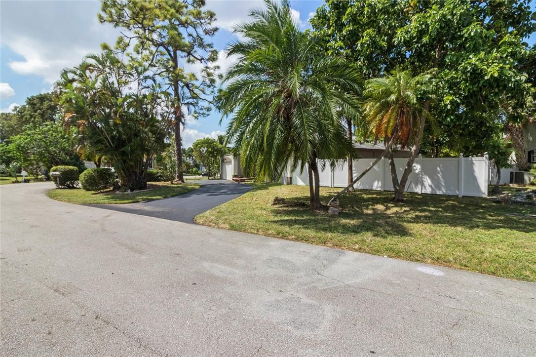 8067 Buttonwood Circle Tamarac, FL 33321 - Photo 31 of 33 a view of outdoor space with trees