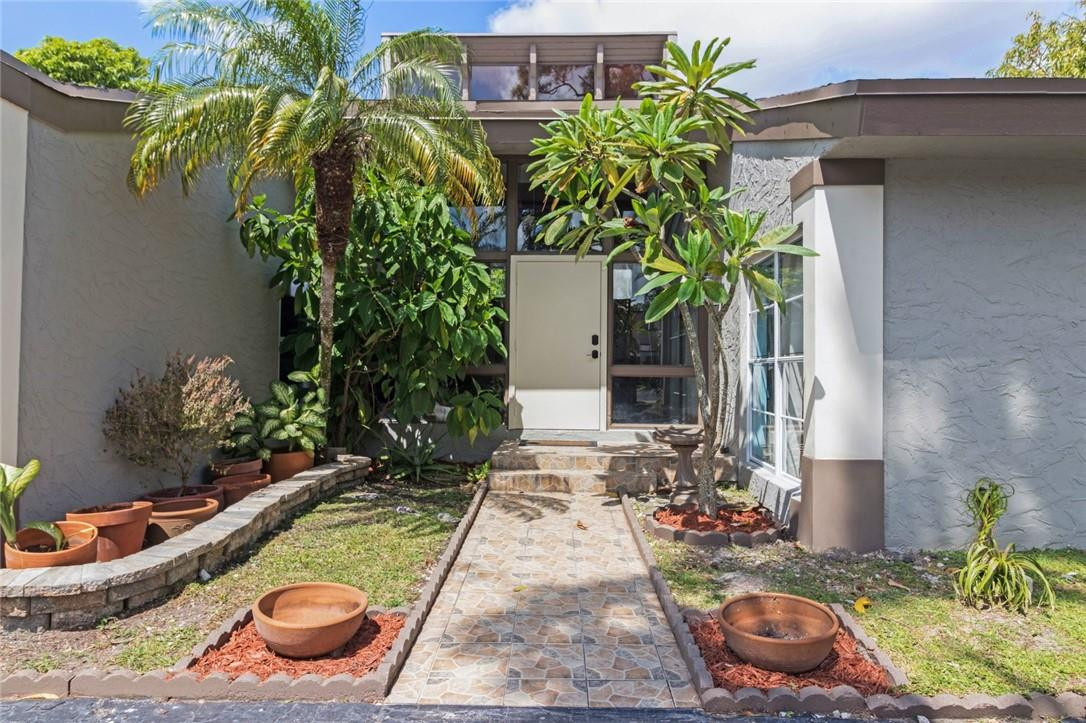 8067 Buttonwood Circle Tamarac, FL 33321 - Photo 33 of 33 a view of a backyard with plants and patio