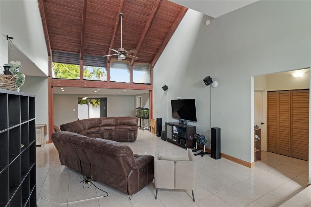 8067 Buttonwood Circle Tamarac, FL 33321 - Photo 6 of 33 a living room with furniture and a flat screen tv