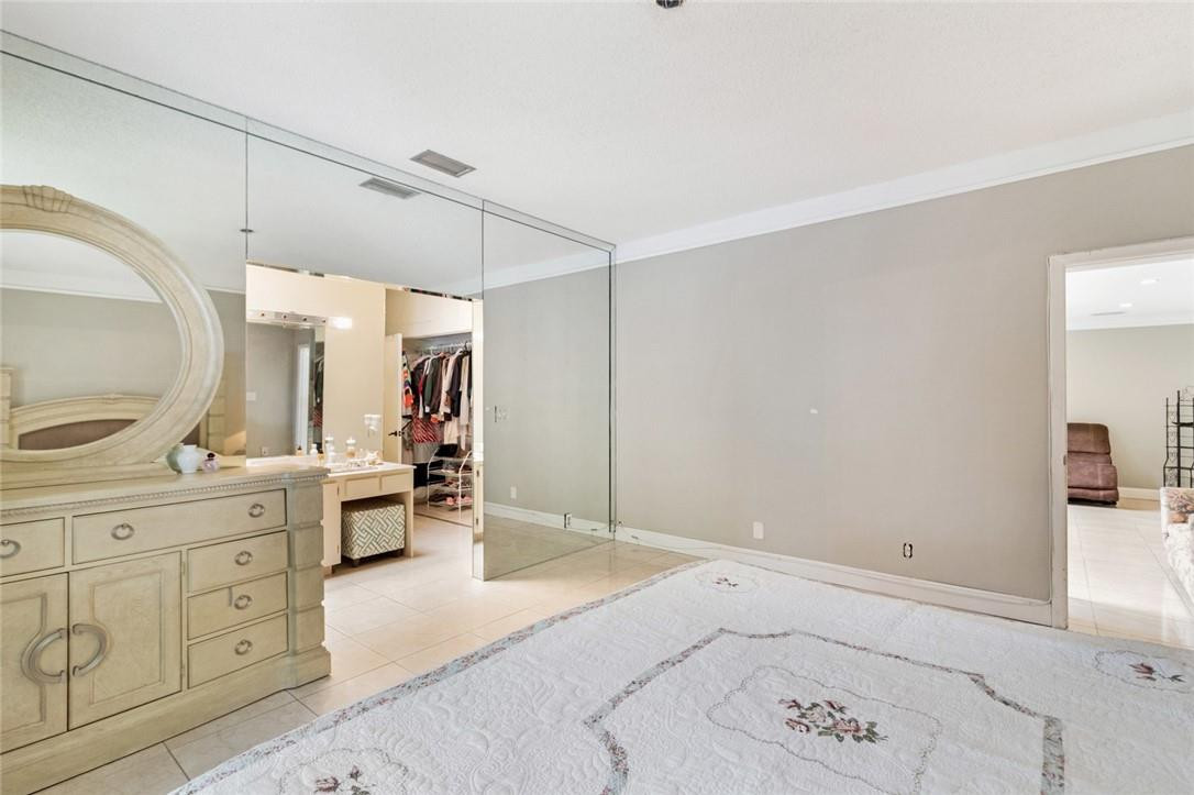 8067 Buttonwood Circle Tamarac, FL 33321 - Photo 10 of 33 a view of a kitchen with cabinets