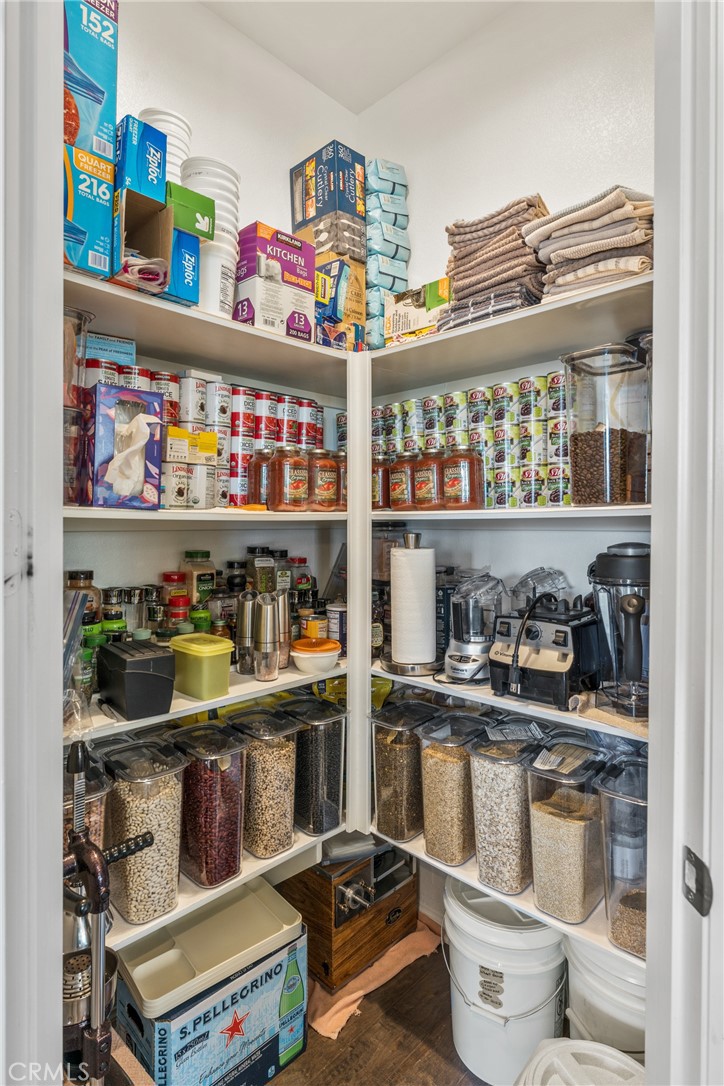 11636 Cascade Street Apple Valley, CA 92308 - Photo 20 of 70 a room with granite countertop lots of different kinds of food