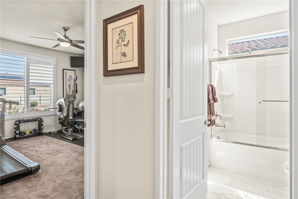 11636 Cascade Street Apple Valley, CA 92308 - Photo 32 of 70 a bathroom with a tub shower and window