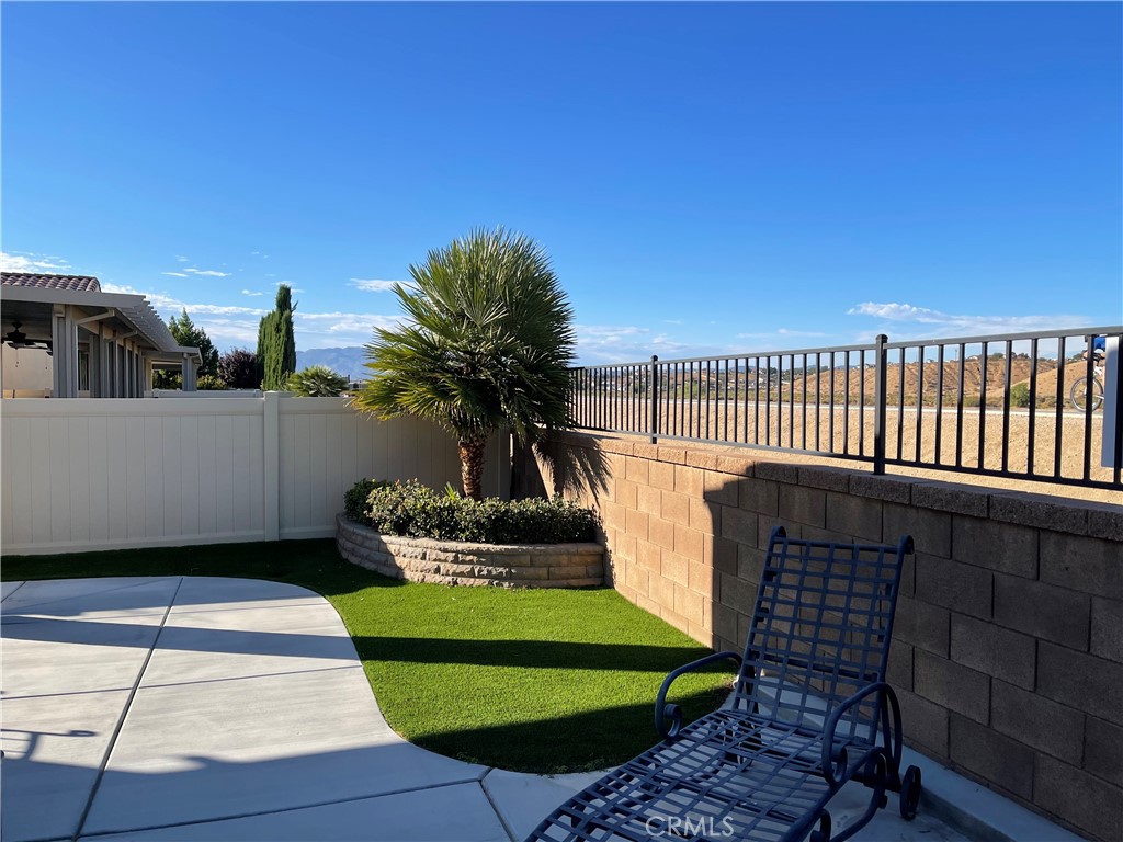11636 Cascade Street Apple Valley, CA 92308 - Photo 47 of 70 a front view of a house with a garden