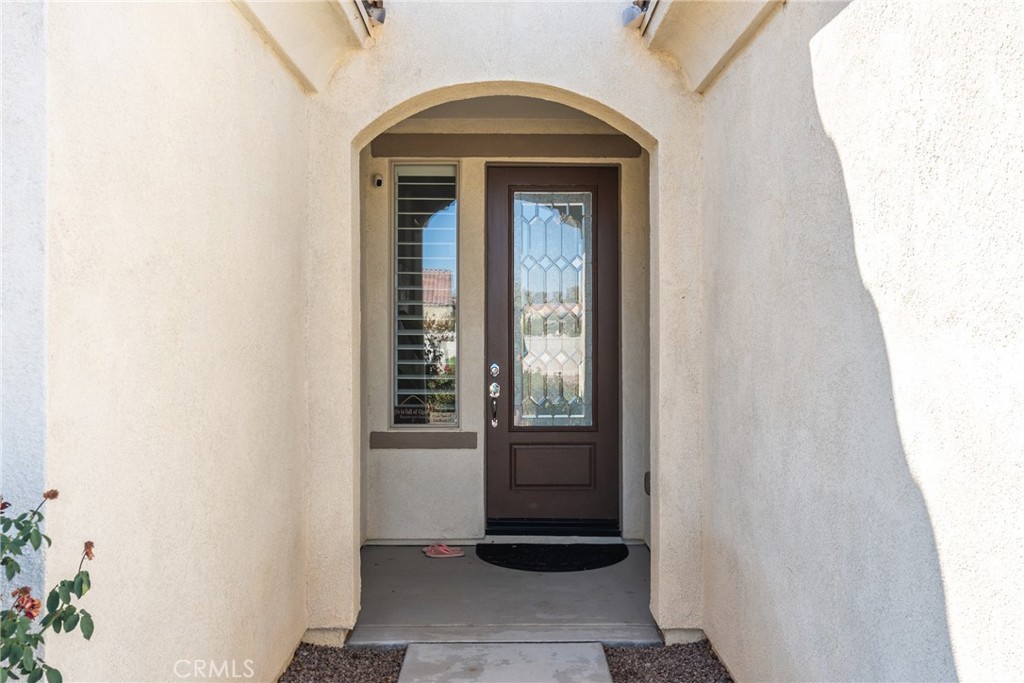 11636 Cascade Street Apple Valley, CA 92308 - Photo 5 of 70 a view of a entryway door of the house